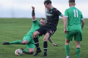 Craig Anderson putting a tackle in during Greenlaw's 3-2 Border Amateur Football Association A division win at Chirnside United on Saturday ahead of a South of Scotland Amateur Cup tie at home to lauder this weekend (Photo: Brian Sutherland)