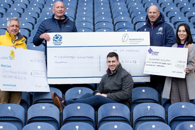 Chris Laidlaw, centre, giving cheques to Ian Rankin, Stuart Dow, Sarah Cheung and Jim Stewart at Murrayfield Stadium in Edinburgh (Photo by Craig Williamson/SNS Group/SRU)