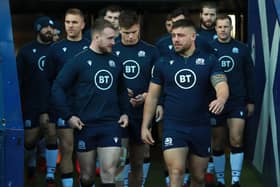 Stuart Hogg leading out his team with Rory Sutherland at Murrayfield in Edinburgh in February last year (Photo by David Rogers/Getty Images)