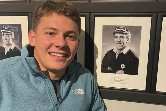 Glasgow Warriors academy scrum-half Jack Oliver alongside a photo of his late dad Greig at Hawick’s Mansfield Park clubrooms on Friday (Photo: Malcolm Grant)