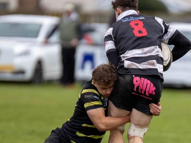Ben Pickles making a tackle for Melrose, on Harry Borthwick, as they lost 39-22 away to Kelso at Poynder Park on Saturday (Photo: Andy McLean)