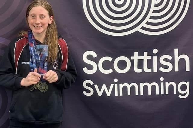 Swimmer Lili Mundell with her gold medals in Aberdeen