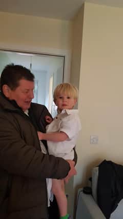 The victim George Gilmour with his grandson Harris.