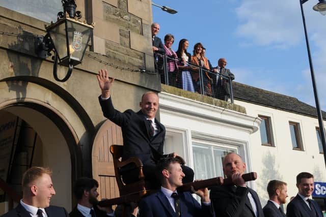 Royal Burgh Standard Bearer Adam Nichol is carried from the Town hall. Photo: Grant Kinghorn.