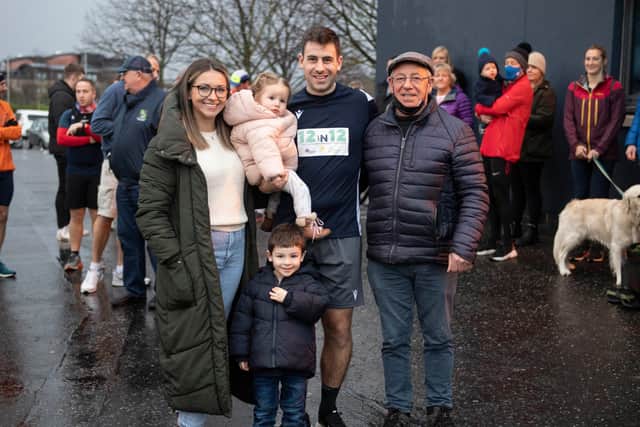 Chris Laidlaw with wife Alanah, dad Roy and children Ivy and Struan Laidlaw after completing his year-long charity marathon challenge in Edinburgh on New Year's Eve (Photo by Paul Devlin/SNS Group/SRU)