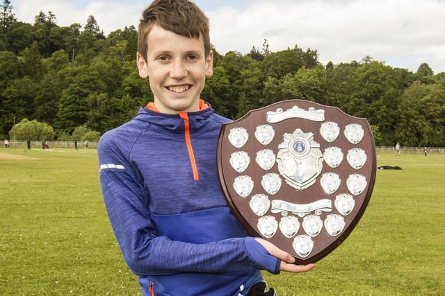 Hawick's Irvine Welsh with the shield for best local performance at 2022's Hawick Border Games after winning the youths' 800m handicap