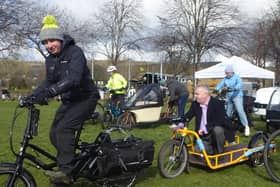 Council convener David Parker enjoys a whirl on one of the ecargo bikes on display.