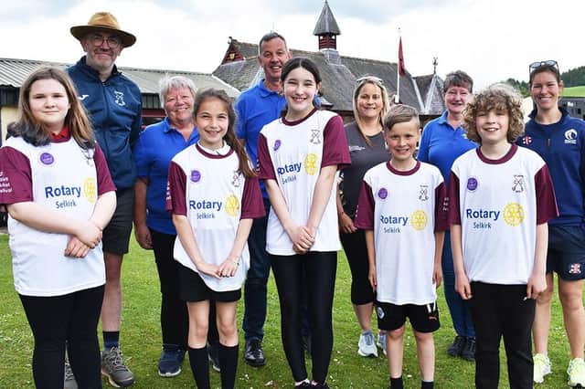 With some of the pupils in their smart new t-shirts are, back from left, Neil Gentleman of Selkirk CC, Eileen Easton (president, Selkirk Rotary), Grant Gill (president-elect), Karen Cornwall (Active Schools), Irene Strafford (president nominee) and Katie McGill (Cricket Scotland).