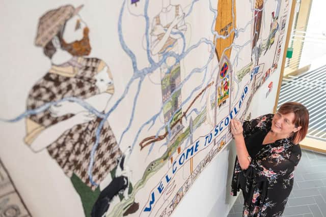 Susie Finlayson , original tapestry stitcher who coordinated the stitching of the new welcome panel, which was first seen completed this week. Photo: Phil Wilkinson.