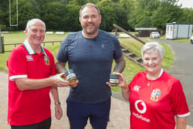 John and Margaret Hogg, Stuart Hogg's parents, presenting former Welsh rugby player Scott Quinnell with a tin of Hawick Balls (Photo: Bill McBurnie)