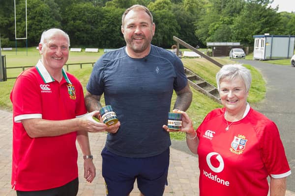 John and Margaret Hogg, Stuart Hogg's parents, presenting former Welsh rugby player Scott Quinnell with a tin of Hawick Balls (Photo: Bill McBurnie)