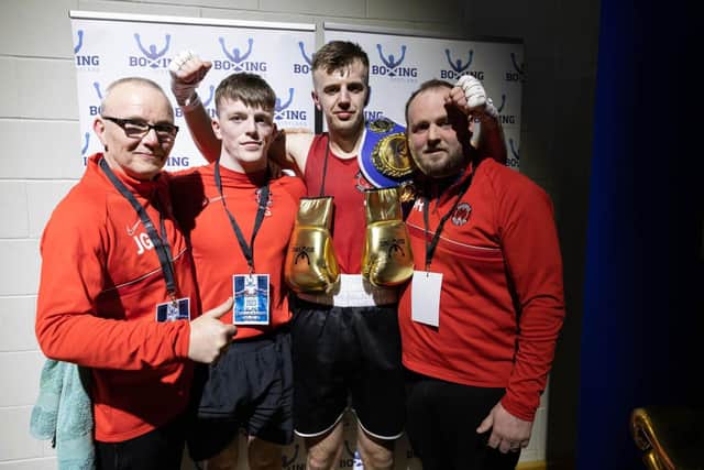 Galashiels boxer Jack Swaney celebrating his Scottish cruiserweight title win at the weekend with coaches Jim Gow, Steven Ross and Jack Grieve (Pic: Boxing Scotland)