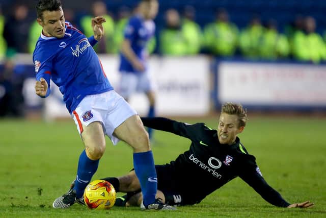 David Atkinson of Carlisle United being tackled by Danny Galbraith of York City during a Sky Bet League Two match in January 2016 (Photo by Dave Thompson/Getty Images)