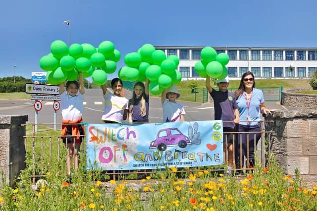 Duns Primary School pupils urged drivers to "switch off and breathe".