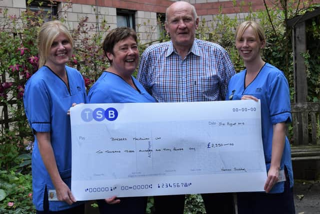 Norman Suddon pictured in 2015 with staff nurse Heather Barnes, nurse consultant Judith Smith and staff nurse Claire Hannah after raising £2,350 via an auction of rugby shirts for Macmillan Cancer Support to thank it for the care he'd received following his diagnosis with the disease two years previously