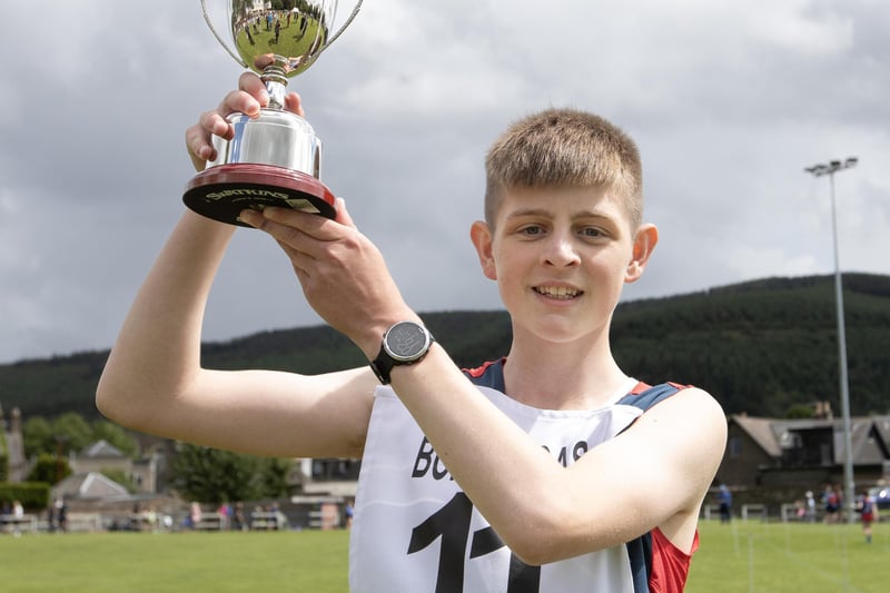 Hawick's Craig Watson with the new Craig Angus Memorial Trophy for winning an unconfined 800m youth race at St Ronan's Border Games on Saturday