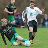 Oliver Stewart tackling Graham Clark during Langlee Amateurs 1-0 win away to Hawick Legion in the Border Amateur Football Association's A division on Saturday (Photo: Brian Sutherland)
