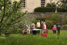 The cast rehearsing the grounds of Traquair House
