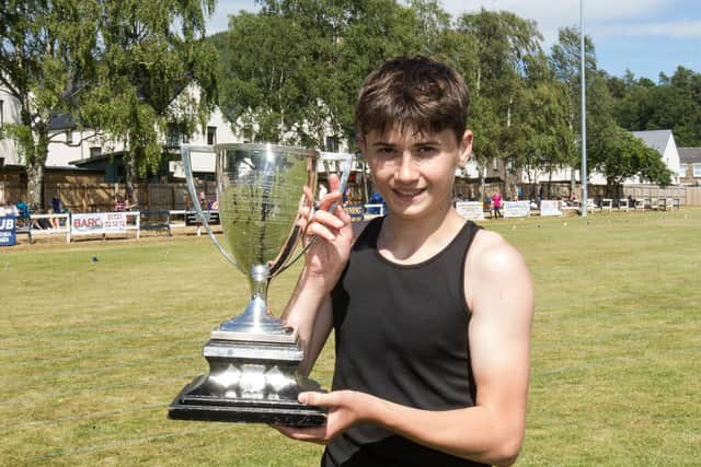 12 year old Stuart Whiteford from Innerleithen winner of the youth 800m handicap with the Americal Cup