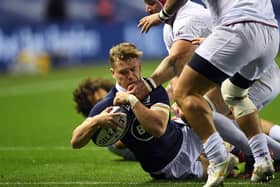Scotland's wing Darcy Graham (L) scores their first try during the Autumn International rugby union Test match between Scotland and Georgia at Murrayfield in Edinburgh on October 23, 2020. (Photo by ANDY BUCHANAN / AFP) (Photo by ANDY BUCHANAN/AFP via Getty Images)