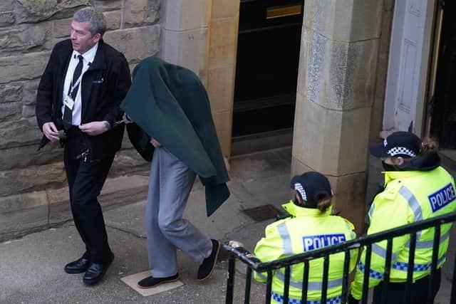 Andrew Miller (covered) being led from Selkirk Sheriff Court following an earlier hearing. Picture: Andrew Milligan/PA Wire