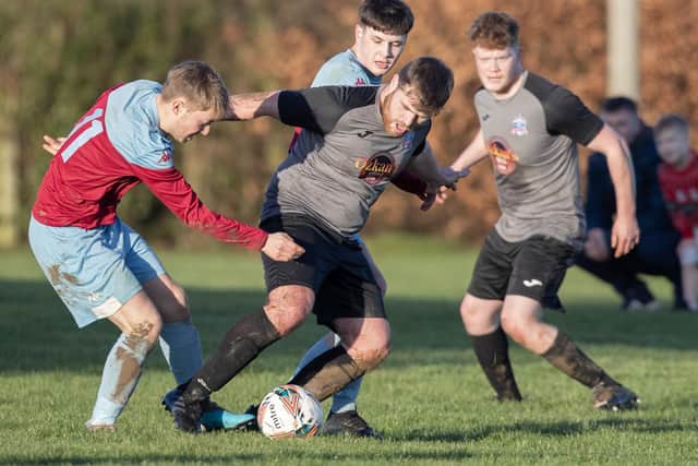 St Boswells' Ali Buchanan challenging Ross Purves for the ball during his side's 12-1 win at home to Selkirk Victoria on Saturday in the Border Amateur Football Association's B division (Photo: Brian Sutherland)