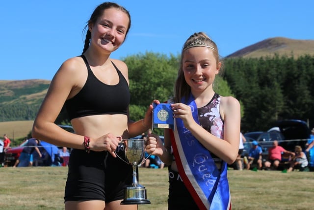Chloe Inglis, left, being presented with a trophy at Morebattle Border Games