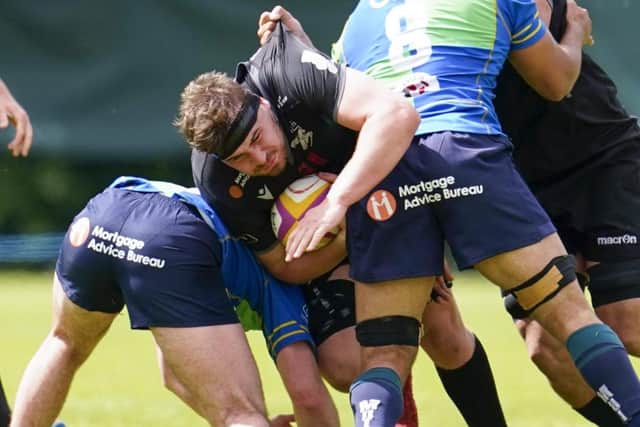 Southern Knights' Rudi Brown being stopped in his tracks by Boroughmuir Bears defenders at Meggetland Sports Complex in Edinburgh on Saturday (Photo by Simon Wootton/SNS Group/SRU)