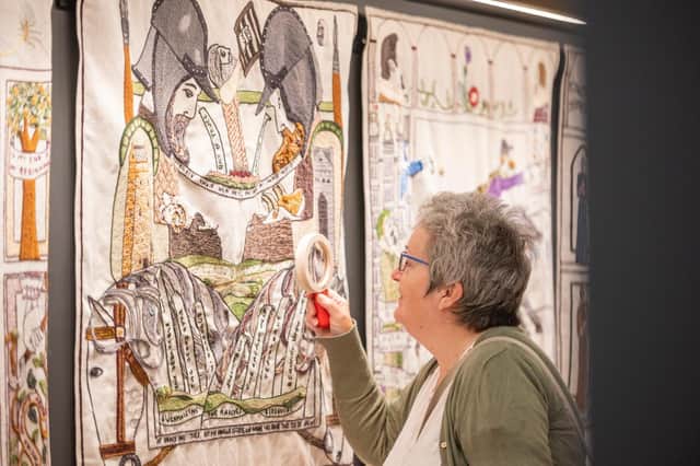 Janice Lees was the first customer to get a chance to view the tapestry in its new home. Photo: Phil Wilkinson.