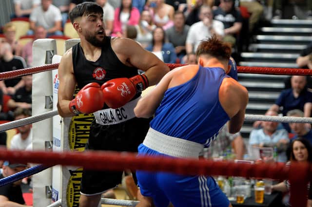 Aqeel Aziz, of Galashiels Boxing Club, winning his senior 71kg bout against Chirnside's Jack Grant by unanimous decision at the former's club's tenth-anniversary home show (Pic: Alwyn Johnston)