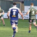 Hawick’s Ronan McKean attacking from deep, watched by Rhys Tait