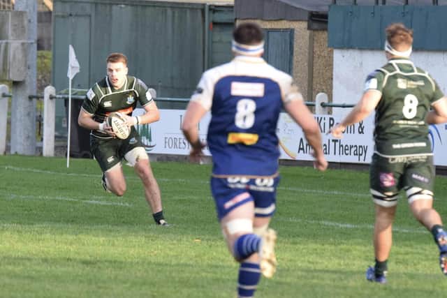 Hawick’s Ronan McKean attacking from deep, watched by Rhys Tait