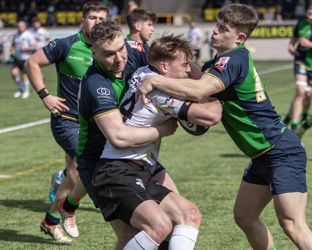 Right-winger Finn Douglas being halted during Southern Knights' 34-17 Fosroc Super Series Sprint win at home to Boroughmuir Bears at Melrose's Greenyards on Saturday (Photo: Craig Murray)