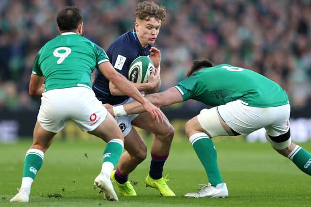 Darcy Graham being tackled by Ireland's Jamison Gibson-Park and Jack Conan yesterday (Photo by Richard Heathcote/Getty Images)