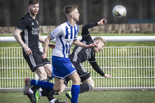 Broomhill's Tony Coutts nudging Gala Fairydean Rovers' Callum Hall off the ball on Saturday (Photo: Bill McBurnie)