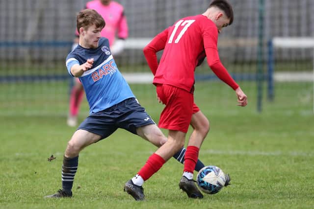 Daniel Taylor putting a tackle in for Vale of Leithen during their 2-0 defeat at home to Rosyth on Saturday in the East of Scotland Football League's first division (Photo: Brian Sutherland)