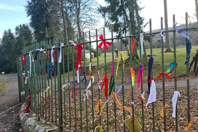 The supporters of the Save Scott Park movement have tied ribbons to the fence to show their dissent at the council's plans.