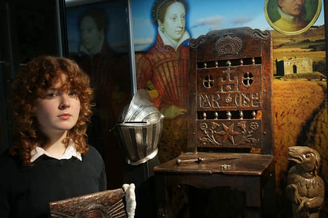 Julia Moffatt, exhibition organiser, helps set up the 2024 Mary Queen of Scots display. © The Borderlands Museum