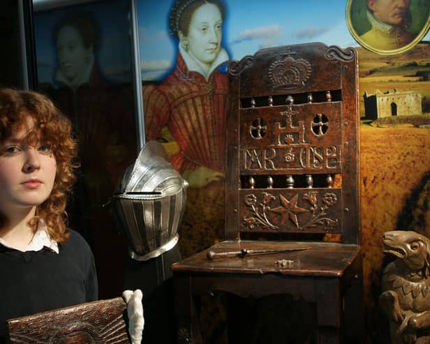 Julia Moffatt, exhibition organiser, helps set up the 2024 Mary Queen of Scots display. © The Borderlands Museum