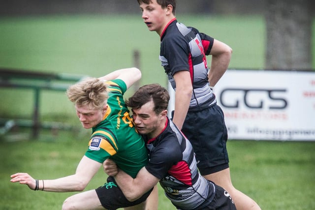 Selkirk Youth Club's Sam McClymont being tackled by Kelso defenders at Earlston's under-18 sevens at the weekend
