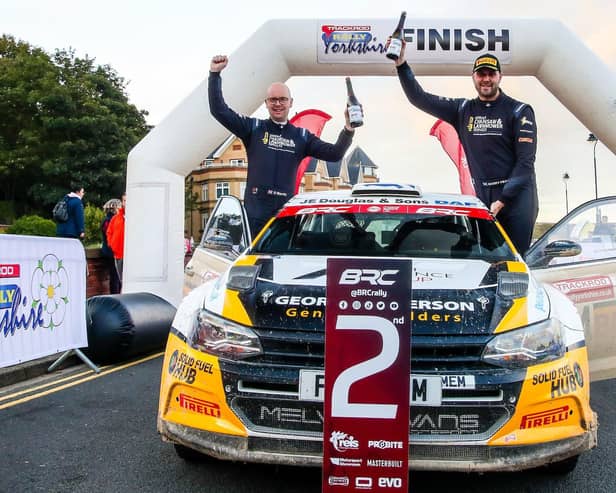 Duns driver Garry Pearson, right, and co-driver Daniel Barritt celebrating finishing second at the Trackrod Rally Yorkshire at Filey at the weekend (Pic: British Rally Championship)