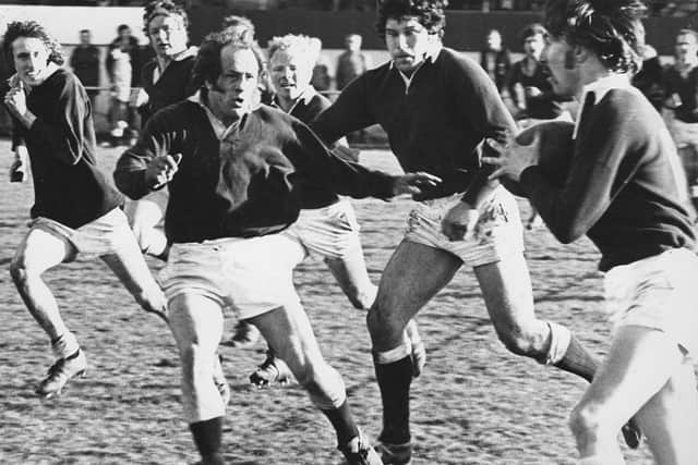 Dave Firth preparing to tackle Hawick’s Ken McCartney in a Border League game. On the left are Selkirk team-mates Billy Rutherford and Paul Tomlinson and the other Greens are Bruce Elliot and Alastair Cranston