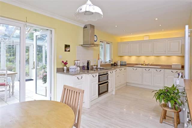 The superb open-plan kitchen leads into the delightful garden room.