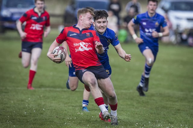 Langholm's Ben Jardine trying to evade Jed-Forest's Kyle Grieve