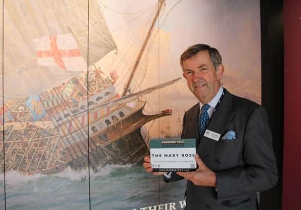 Rear Admiral John Lippiett, with the Flodden Ecomuseum plaque at the Mary Rose museum