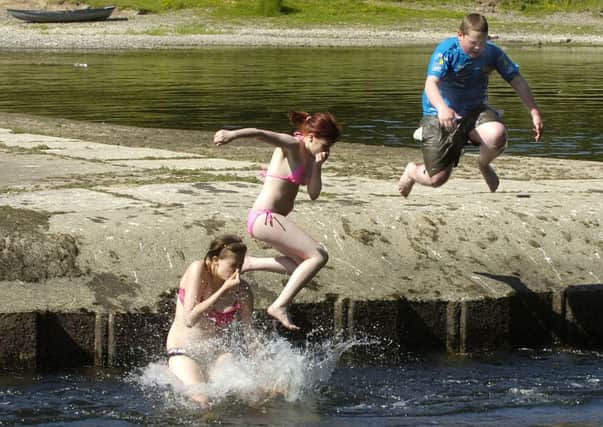Youngsters enjoy the Tweed at Coldstream on a summer day
