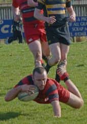Jamie Renton touches down to score a try for Duns against Hawick Harlequins. Picture by Billy Gillie