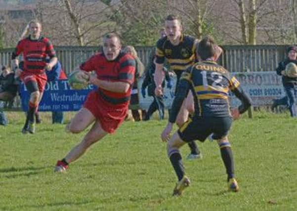 Jamie Renton on his way to scoring a try for Duns against Hawick Harlequins. Picture by Billy Gillie