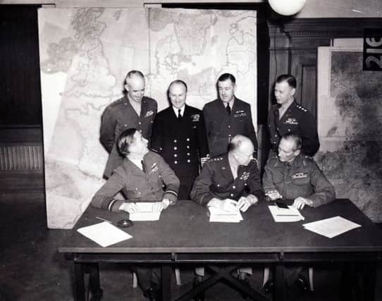 Senior Allied military staff involved in Operation Overlord. 
Left to right, back row: Lieutenant-General Omar Bradley (1st US Army), Admiral Sir Bertram Ramsey (Command Allied Naval Forces), Air Chief Marshal Sir Trafford Leigh Mallory (Commander Allied Air Forces), Lieutenant-General Beddell Smith (Chief of Staff to General Eisenhower). Front: Air Chief Marshal Sir Arthur Tedder (Deputy Supreme Commander), General Dwight Eisenhower (Supreme Commander), and Field Marshal Bernard Montgomery (Commander 21st Army Group).