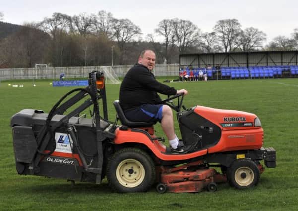 Easter youth football training at Selkirk Football Club. Selkirk FC manager Stevie Forest cutting the pitch.